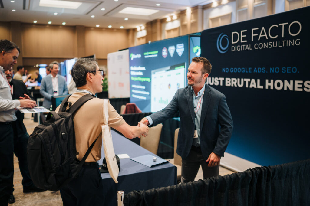 A personal injury lawyer networking with an exhibitor at the Personal Injury Mastermind Conference