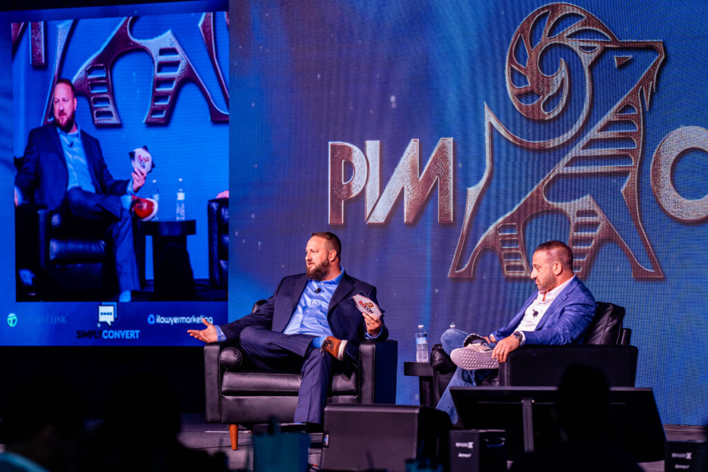 Chris Dreyer and Personal Injury Attorney Matt Dolman on stage at the Personal Injury Mastermind Conference at The Phoenician in Scottsdale, Arizona.