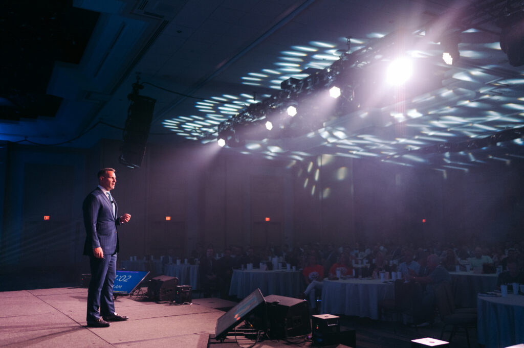 Personal Injury Attorney speaking about branding to a group of other lawyers at the Personal Injury Mastermind Conference
